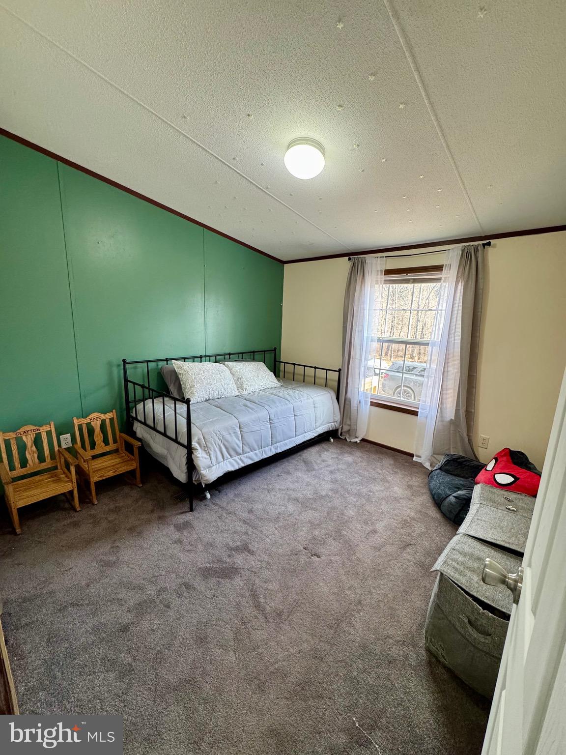 73 Mill Gap Road Brandywine, WV 26802 - Photo 28 of 35 a spacious bedroom with a bed and a window