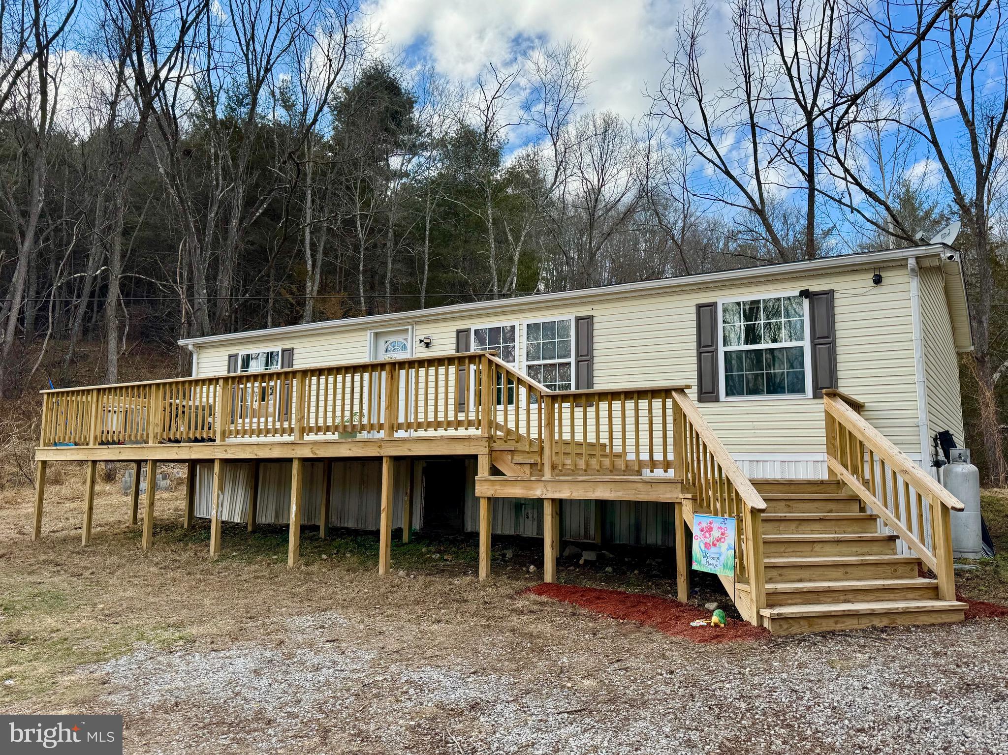 73 Mill Gap Road Brandywine, WV 26802 - Photo 3 of 35 a view of a house with a yard and sitting area