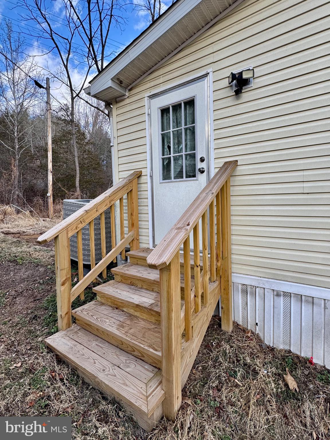 73 Mill Gap Road Brandywine, WV 26802 - Photo 34 of 35 a view of a house with wooden floor and a small yard