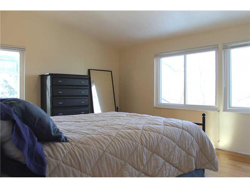 154 Maple Heights Road Pittsburgh, PA 15232 - Photo 11 of 17 Master Bedroom. Master bedroom with 3 windows and angled ceiling.