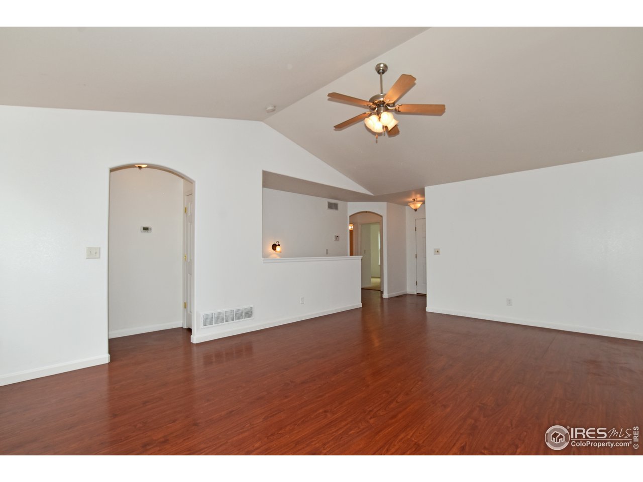 924 Cliffrose Way Severance, CO 80550 - Photo 14 of 40 a view of empty room with wooden floor