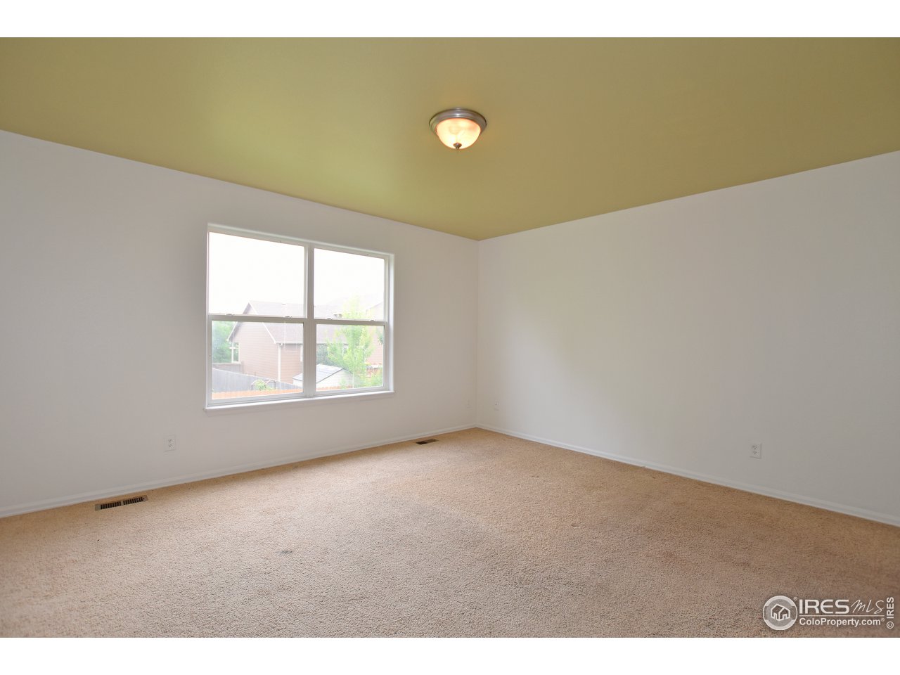 924 Cliffrose Way Severance, CO 80550 - Photo 22 of 40 a view of an empty room with a window