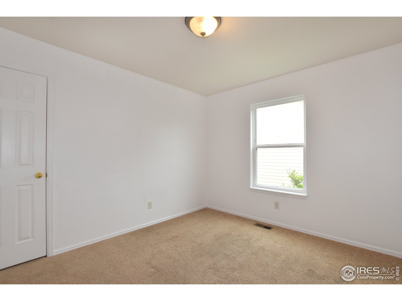 924 Cliffrose Way Severance, CO 80550 - Photo 30 of 40 a view of an empty room with a window