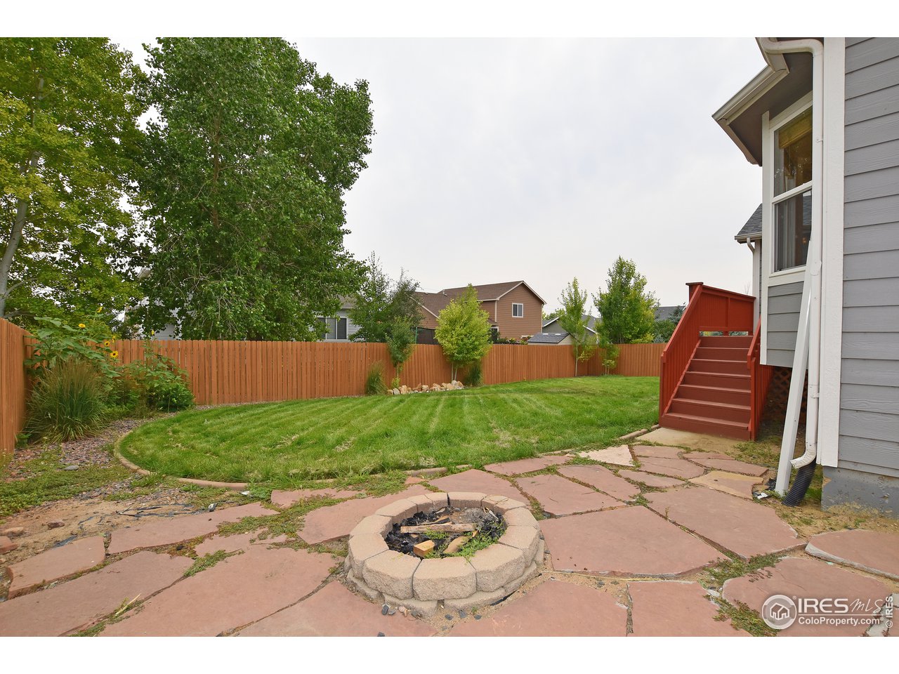 924 Cliffrose Way Severance, CO 80550 - Photo 3 of 40 a view of a backyard with sitting area