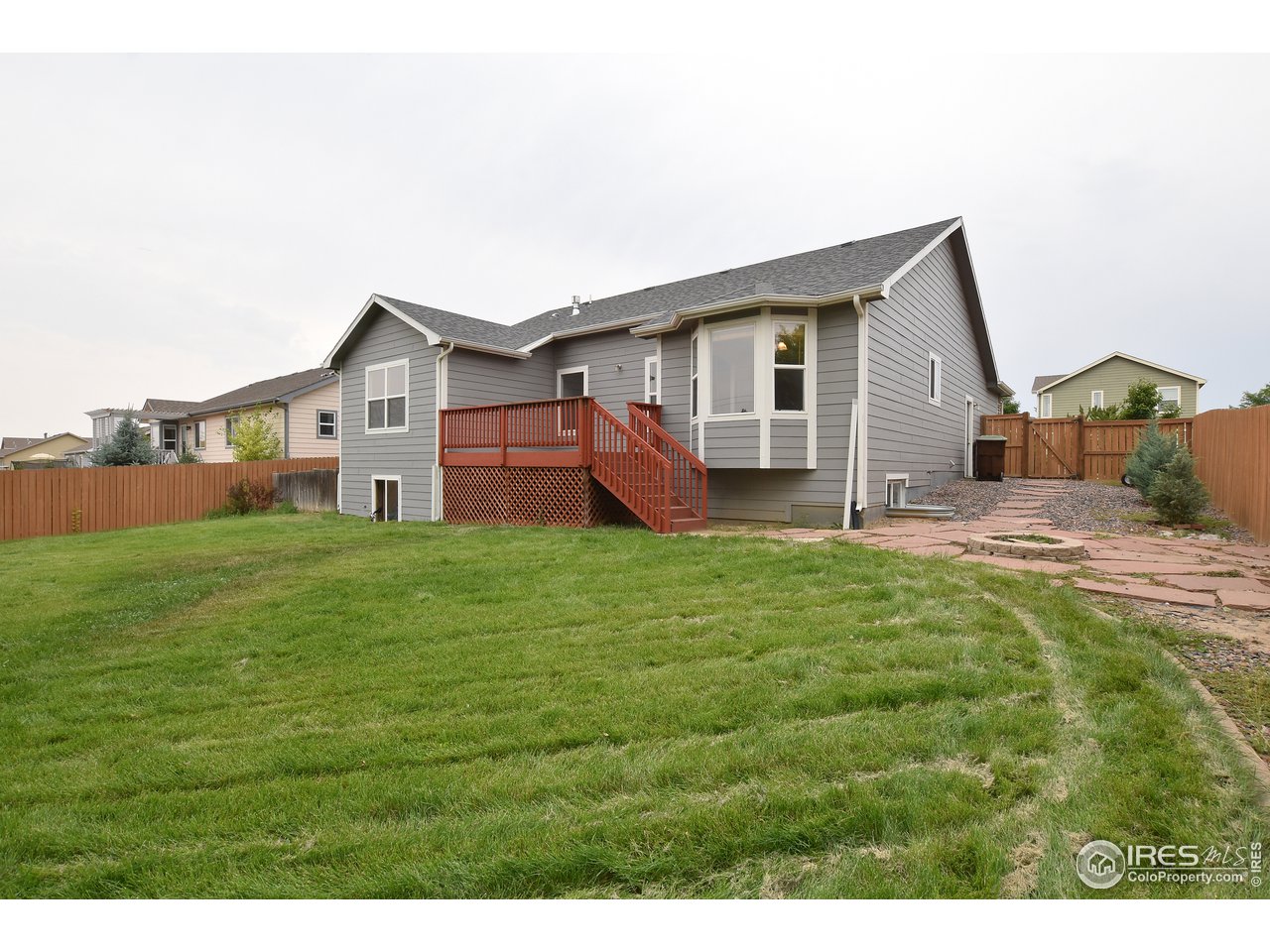 924 Cliffrose Way Severance, CO 80550 - Photo 4 of 40 a view of a house with a yard and sitting area