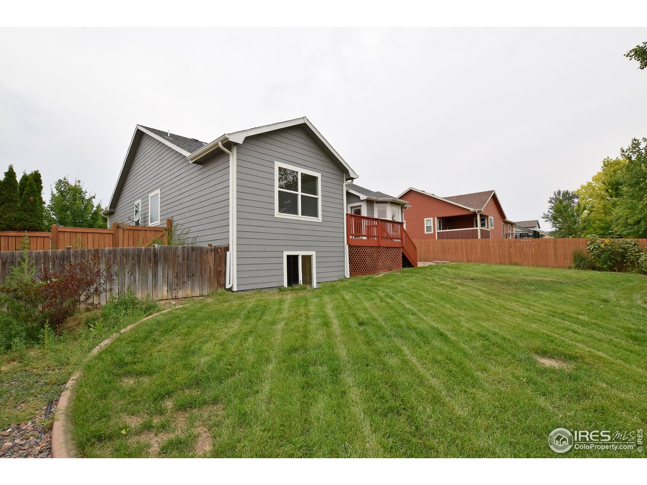 924 Cliffrose Way Severance, CO 80550 - Photo 6 of 40 a backyard of a house with lots of green space