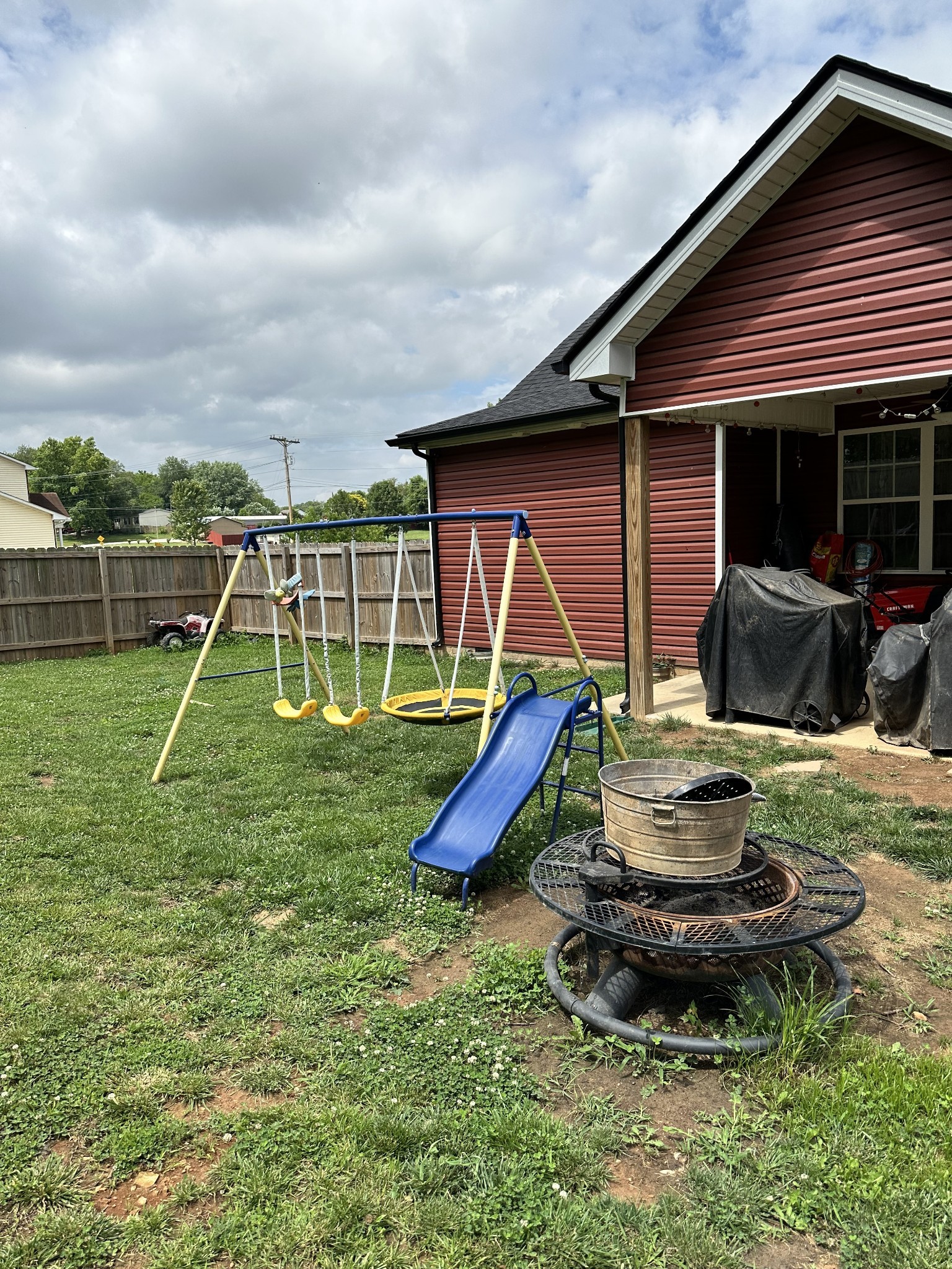 85 Good Hope Cemetery Road Oak Grove, KY 42262 - Photo 6 of 46 a view of a backyard with table and chairs