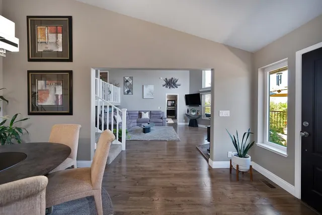 a view of a dining room with furniture and chandelier