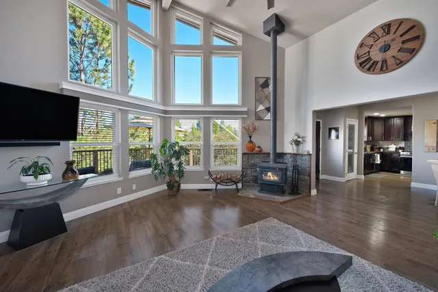 a living room with patio furniture and a large window