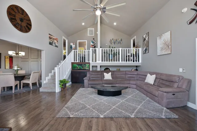a living room with fireplace furniture and a flat screen tv