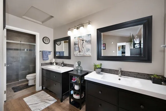 a bathroom with a shower a toilet and a shower