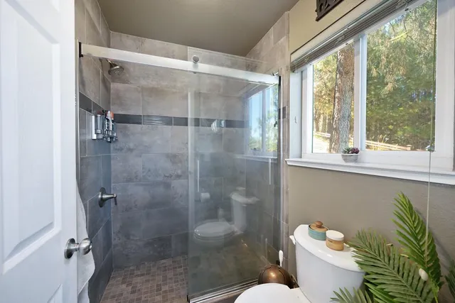 a kitchen with stainless steel appliances granite countertop sink stove refrigerator and cabinets