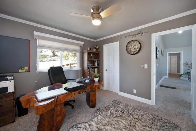 a bedroom with a large bed and flat screen tv
