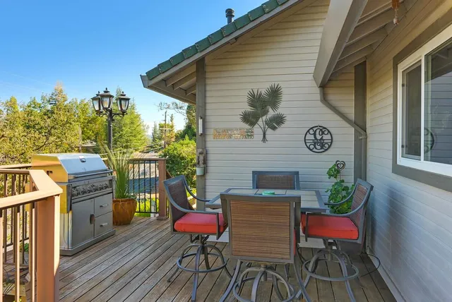 a view of a chairs and table in patio