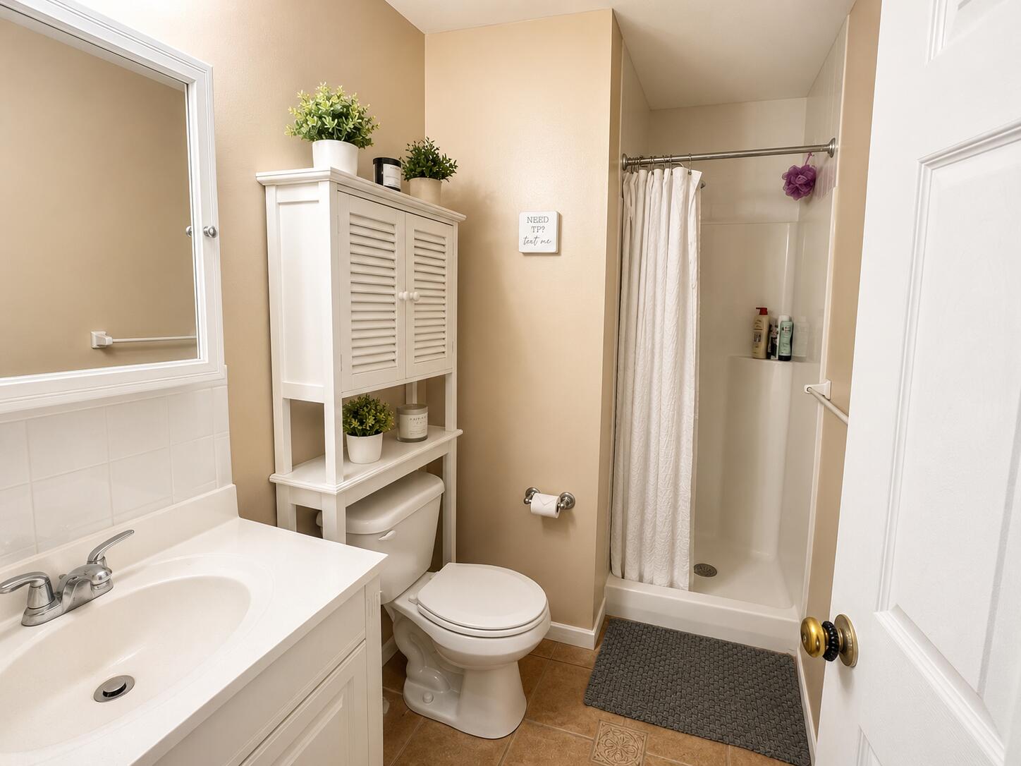 63 Security Street, Unit 1 Hyannis, MA 02601 - Photo 7 of 8 a bathroom with a sink toilet and shower