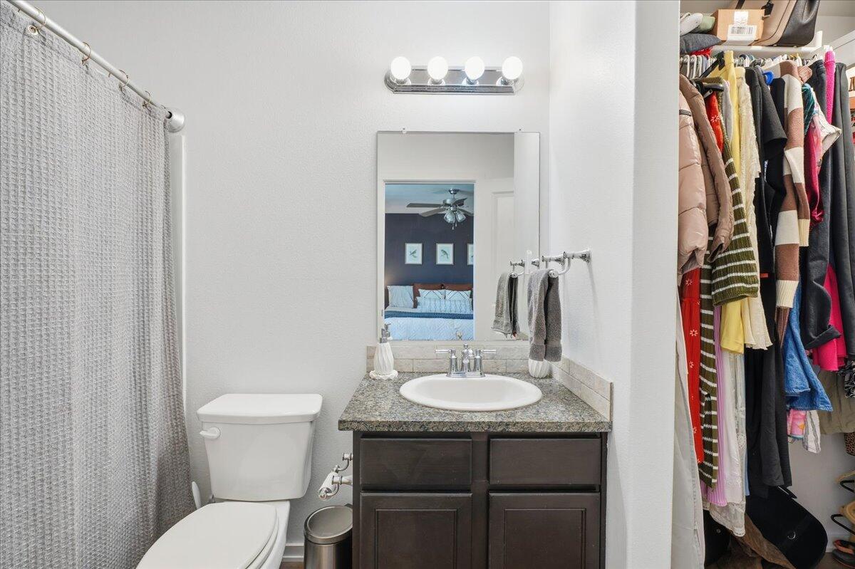 13804 Paris Avenue Lubbock, TX 79423 - Photo 15 of 28 a bathroom with a sink toilet and shower