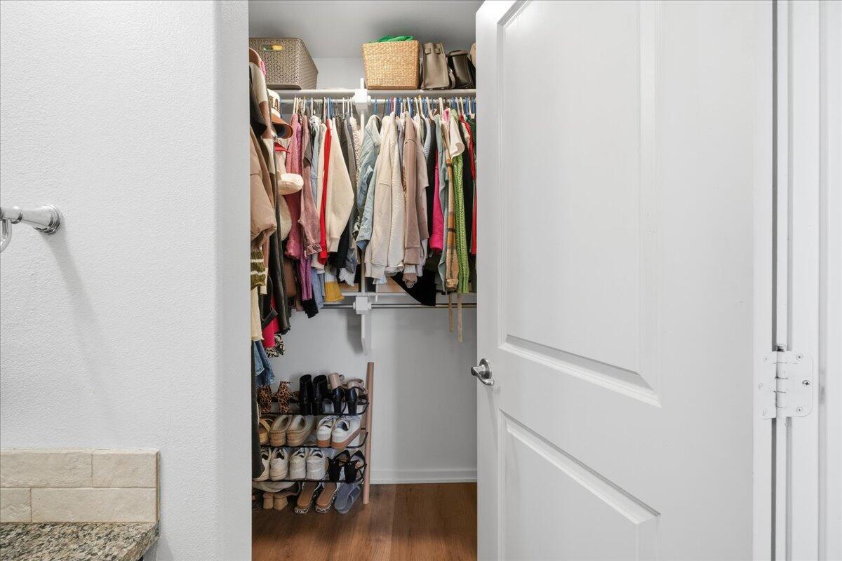 13804 Paris Avenue Lubbock, TX 79423 - Photo 16 of 28 a view of walk in closet with clothes and shoes