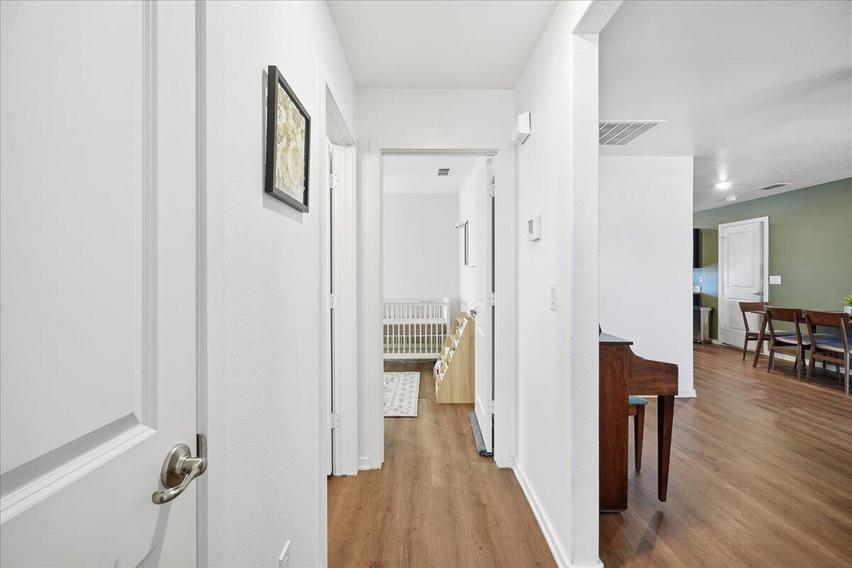 13804 Paris Avenue Lubbock, TX 79423 - Photo 17 of 28 a view of a hallway with wooden floor windows and livingroom