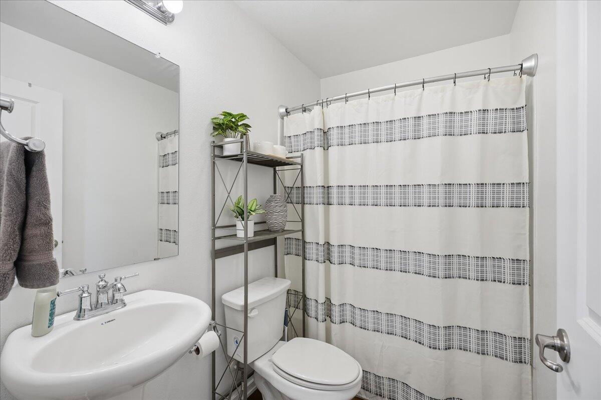13804 Paris Avenue Lubbock, TX 79423 - Photo 20 of 28 a bathroom with a sink toilet and shower