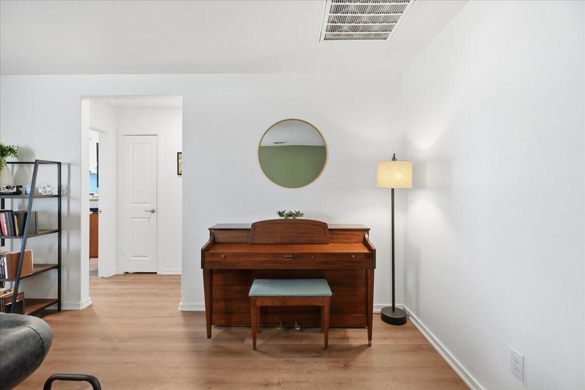 13804 Paris Avenue Lubbock, TX 79423 - Photo 5 of 28 a room with furniture and a wooden floor