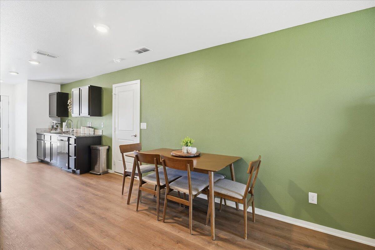 13804 Paris Avenue Lubbock, TX 79423 - Photo 7 of 28 a dining room with furniture and kitchen view