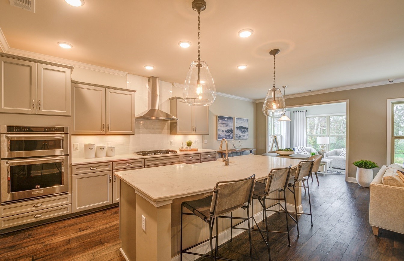 1231 Pebble Run Road Hendersonville, TN 37075 - Photo 3 of 53 a kitchen with kitchen island a stove a table and chairs in it