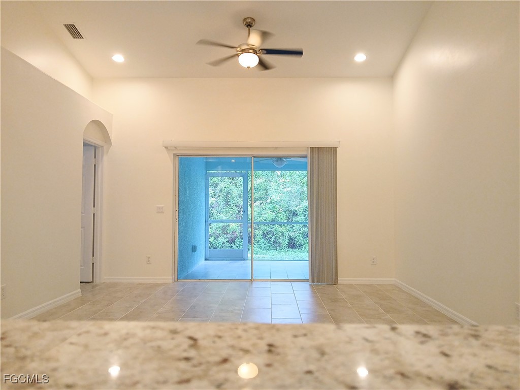 4613-4615 29th Street Southwest Lehigh Acres, FL 33973 - Photo 11 of 33 a view of a livingroom with a ceiling fan and window