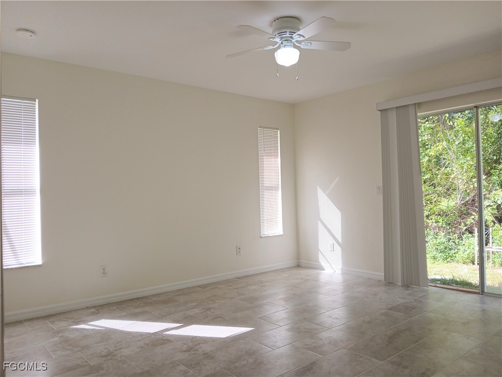 4613-4615 29th Street Southwest Lehigh Acres, FL 33973 - Photo 14 of 33 a view of room with window and ceiling fan