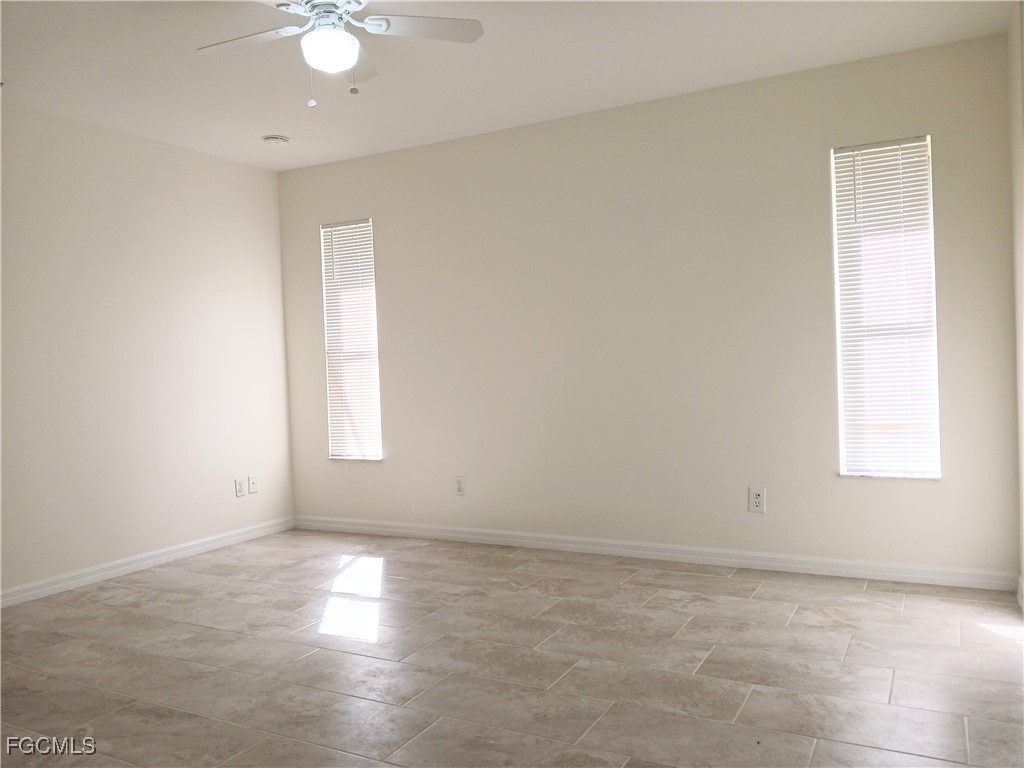 4613-4615 29th Street Southwest Lehigh Acres, FL 33973 - Photo 18 of 33 an empty room with windows