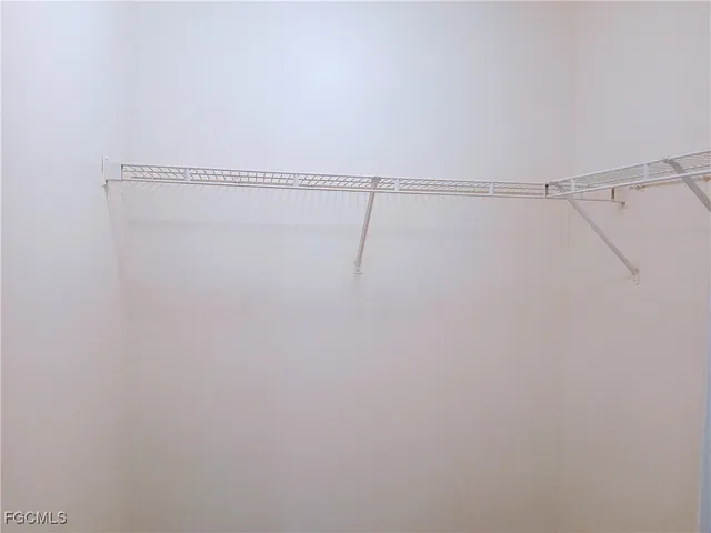 a view of a room with racks on the wall