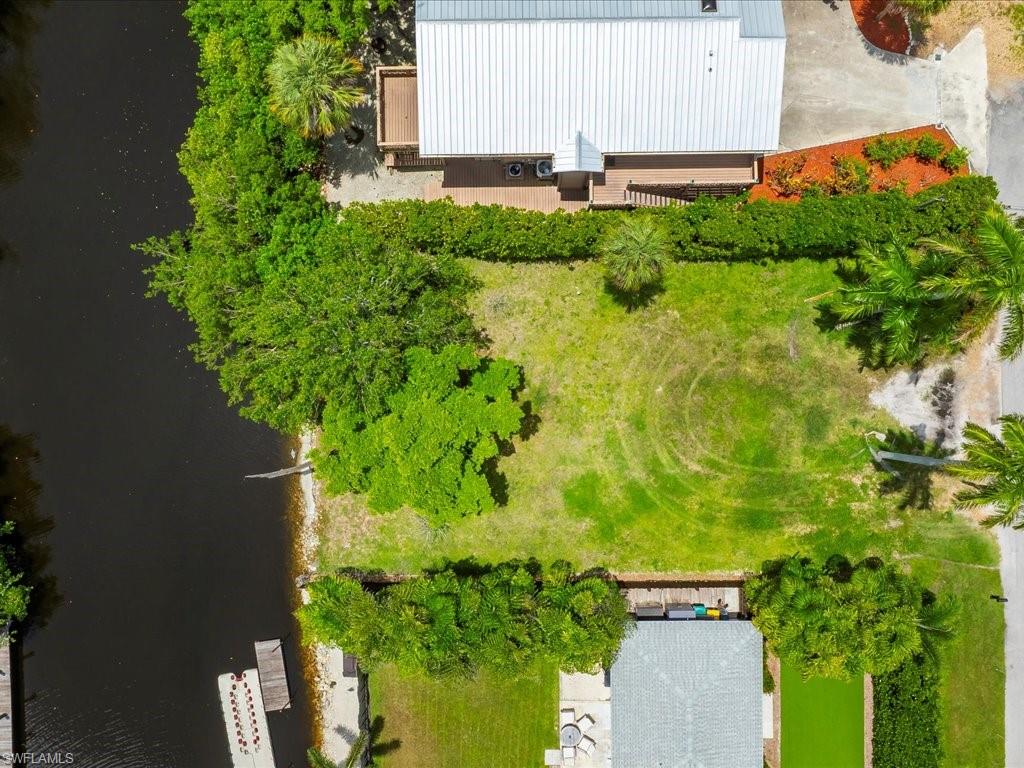 2977 Poplar Street Naples, FL 34112 - Photo 2 of 10 a view of a garden with plants