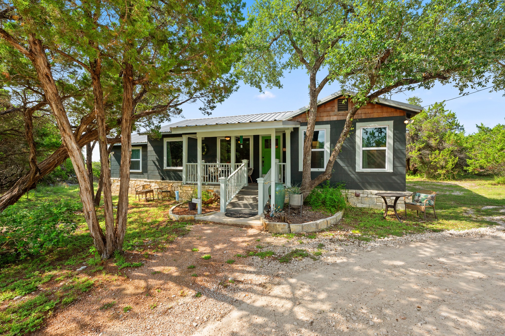 12932 Nutty Brown Road Austin, TX 78737 - Photo 20 of 40 Roadrunner - Welcomes you with classic Hill Country charm and a private setting among mature trees.