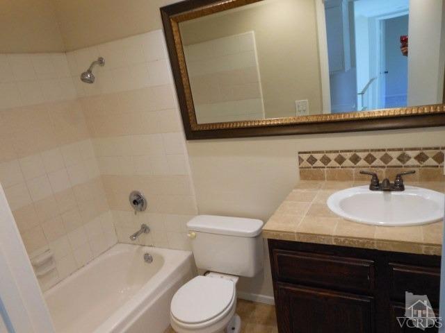 2287 Birchfield Street Simi Valley, CA 93065 - Photo 14 of 22 a bathroom with a sink a toilet and bathtub