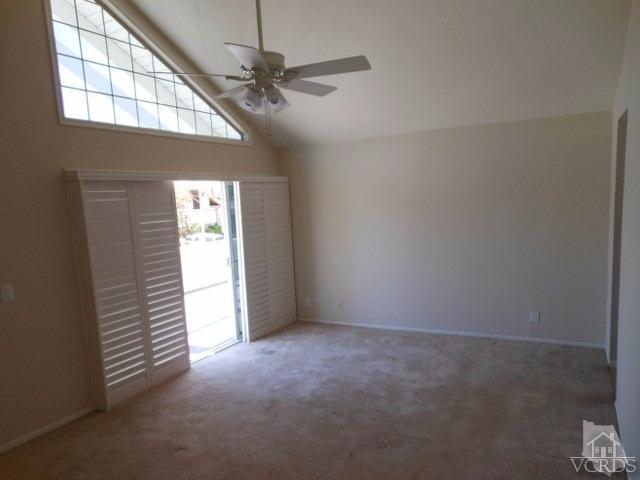2287 Birchfield Street Simi Valley, CA 93065 - Photo 16 of 22 en empty room with windows and chandelier fan