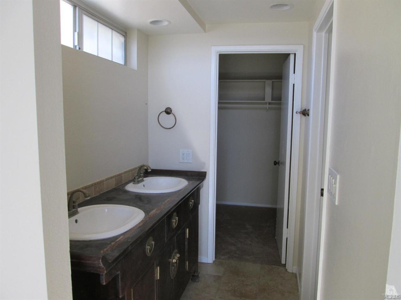 2287 Birchfield Street Simi Valley, CA 93065 - Photo 18 of 22 a bathroom with a sink and a mirror