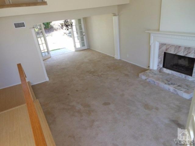2287 Birchfield Street Simi Valley, CA 93065 - Photo 6 of 22 a view of an empty room with furniture and a fireplace