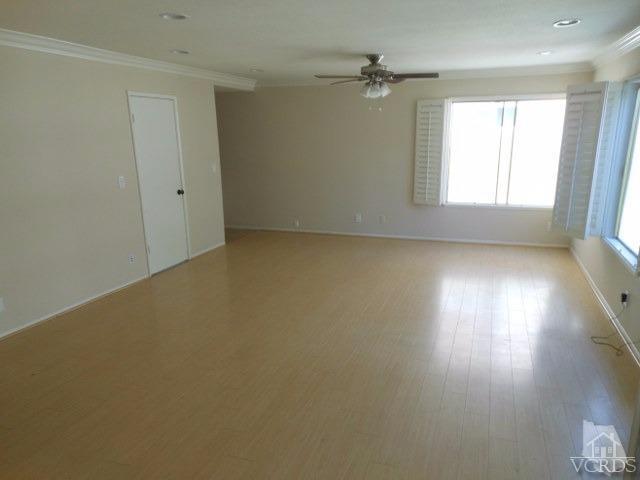 2287 Birchfield Street Simi Valley, CA 93065 - Photo 10 of 22 an empty room with a window and wooden floor