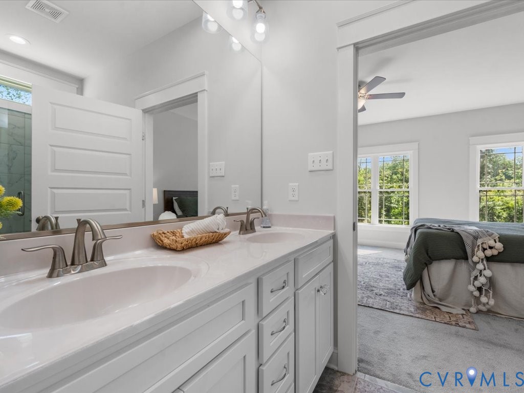 1280 Mill Quarter Road Powhatan, VA 23139 - Photo 26 of 50 Bathroom with double vanity, a stall shower, and a
