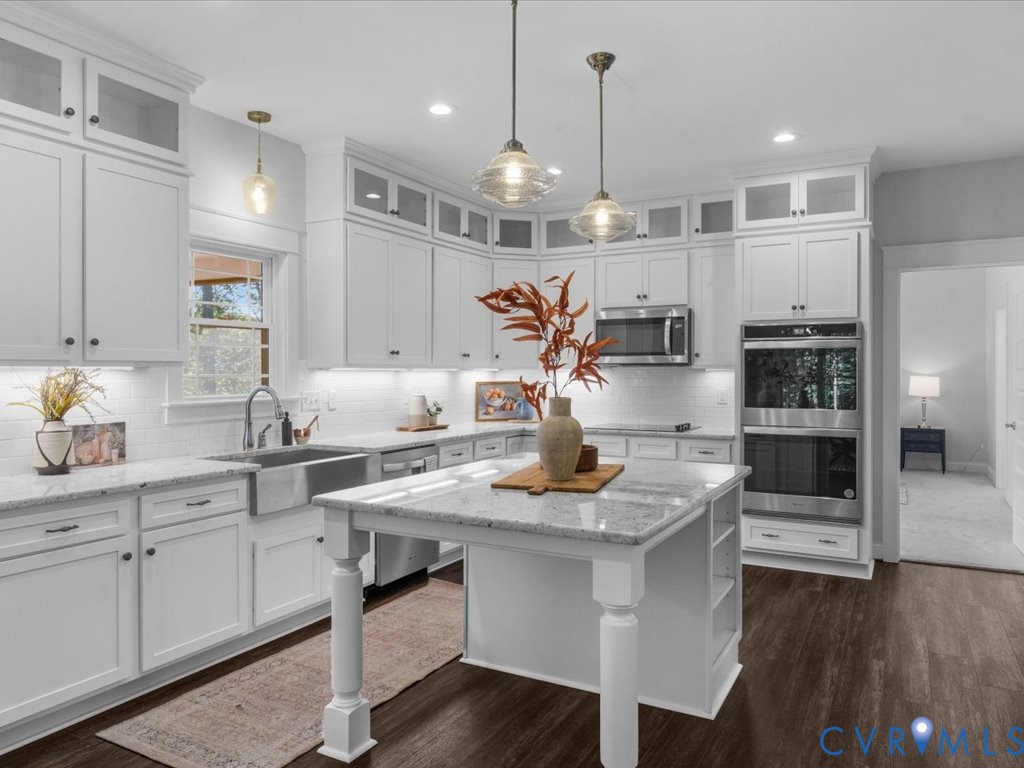 1280 Mill Quarter Road Powhatan, VA 23139 - Photo 4 of 50 Kitchen featuring tasteful backsplash, light stone