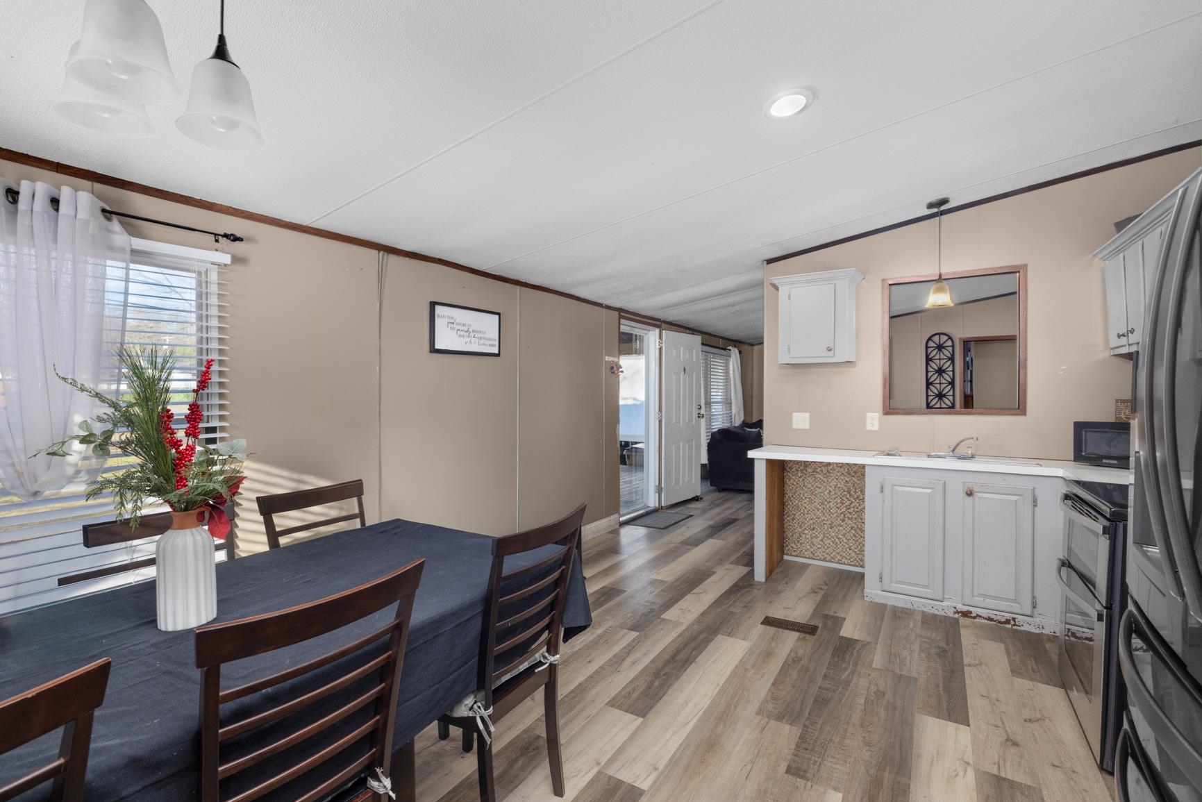 7225 Bridgewater Church Road Cordova, TN 38018 - Photo 9 of 20 Dining area featuring light wood-type flooring, ornamental molding, and lofted ceiling