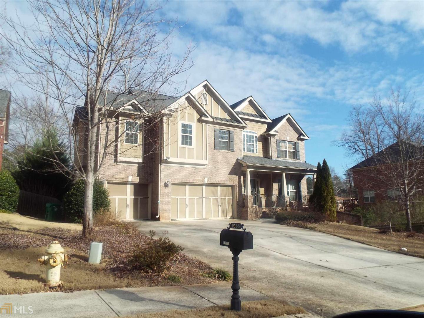 1055 Longshore Drive Decatur, GA 30032 - Photo 1 of 1 a front view of a house with a yard and garage