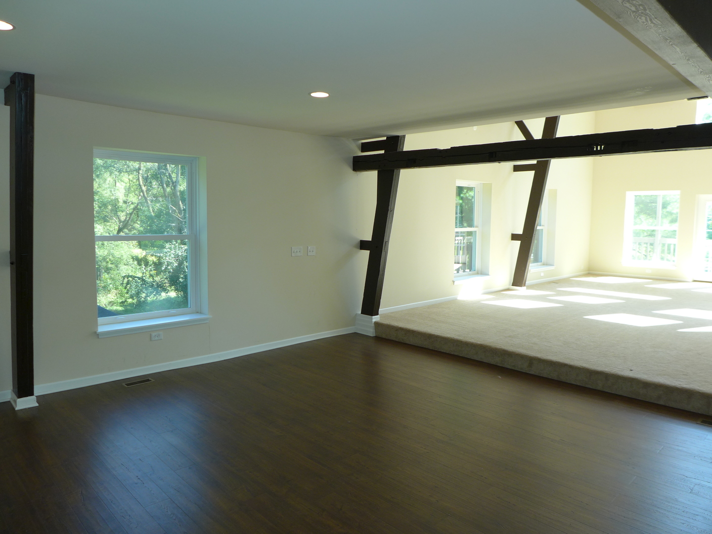 6316 Johnsburg Road Spring Grove, IL 60081 - Photo 12 of 29 a view of an empty room with wooden floor and a window