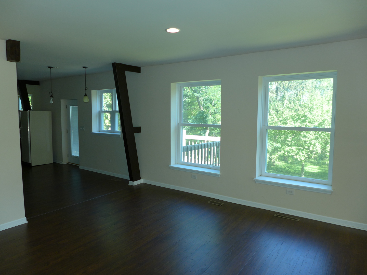 6316 Johnsburg Road Spring Grove, IL 60081 - Photo 13 of 29 a view of an empty room with glass door and windows