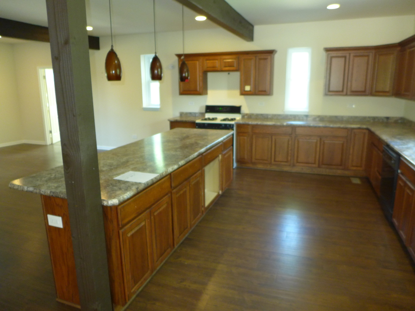 6316 Johnsburg Road Spring Grove, IL 60081 - Photo 15 of 29 a kitchen with stainless steel appliances granite countertop a sink and a stove top oven