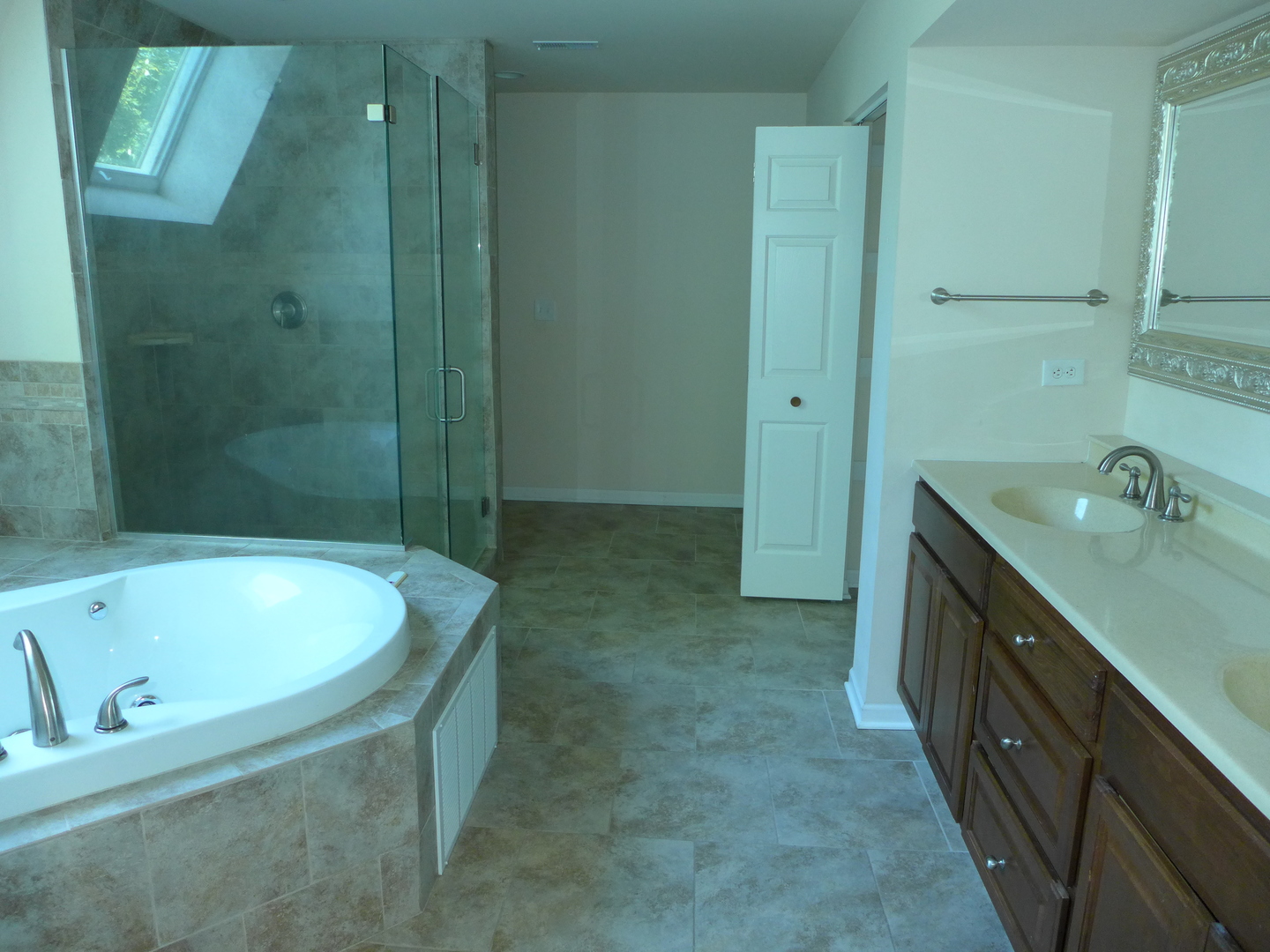 6316 Johnsburg Road Spring Grove, IL 60081 - Photo 22 of 29 a bathroom with a tub sink and mirror