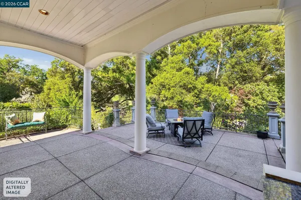 a view of a patio with a table and chairs