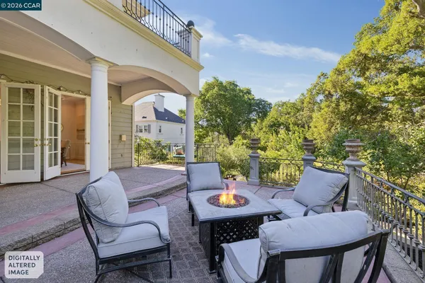 a view of a patio in the backyard