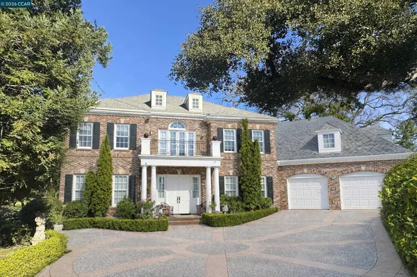 front view of a house with a garden