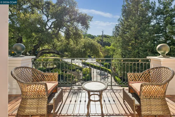 a view of a chair and table on the deck
