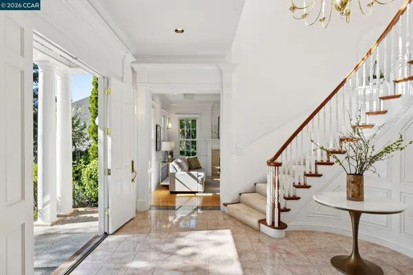 a view of staircase with wooden floor and a rug